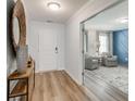 Bright entryway with hardwood floors leads to the living area with contemporary decor at 911 Agostino Dr., Myrtle Beach, SC 29579