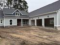 View of the home's exterior, showcasing a spacious three-car garage at 1007 Brood Ct., Conway, SC 29526