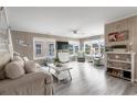 Bright living room with beach-themed decor, wood floors, and a comfortable seating arrangement at 1031 N Dogwood Dr., Surfside Beach, SC 29575