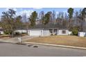 Well-maintained single-story home with a two-car garage, basketball hoop, and manicured lawn at 109 Jessica Lakes Dr., Conway, SC 29526