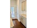 Well-lit kitchen showcasing granite countertops, tile backsplash, and wood flooring at 1091 Forest Bend Dr., Calabash, NC 28467