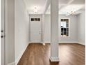 Bright entryway with hardwood floors and a clear view into another room at 1111 Forest Bend Dr., Calabash, NC 28467