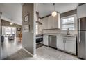 Well-lit kitchen with stainless steel appliances, modern white cabinets, and marble countertops at 1205 Formby Ct., Myrtle Beach, SC 29588