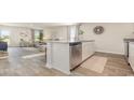Open-concept kitchen with stainless steel appliances, granite countertops, and views of the living room at 153 Leyland Cypress Dr, Conway, SC 29527