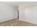 Cozy bedroom with carpet, closet, and a door leading to another room at 156 Parmelee Dr. # B, Murrells Inlet, SC 29576