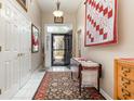 Bright foyer featuring ceramic tile floors, decorative rug, and decorative accents at 3178 River Bluff Ln., Little River, SC 29566