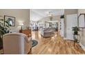 Spacious living room featuring hardwood floors, vaulted ceilings, and neutral paint scheme at 322 Crooked Oak Dr., Pawleys Island, SC 29585