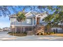 Charming home with brick foundation, stately staircase, and a well-manicured front yard at 3567 Marion Ln., Murrells Inlet, SC 29576
