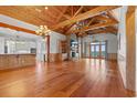 Open living room featuring wood floors, a vaulted ceiling, and a view of the water at 3567 Marion Ln., Murrells Inlet, SC 29576