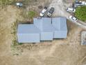 Aerial view of the home showing the metal roof and surrounding land at 4612 Red Bluff Rd., Loris, SC 29569