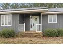 Charming entry with brick steps and a 'Welcome' wreath on the front door at 4612 Red Bluff Rd., Loris, SC 29569