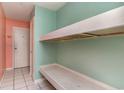 Hallway with built-in bunk beds and a neutral tile floor leading towards the unit's entrance, offering practical use of space at 5905 S Kings Hwy. # 235B, Myrtle Beach, SC 29575