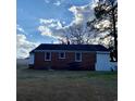 Rear exterior view of home with a brick facade at 611 E Ashland St., Andrews, SC 29510