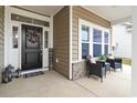 Inviting front porch area with seating, a welcome sign, and decorative touches for a cozy ambiance at 797 Harrison Mill St., Myrtle Beach, SC 29579