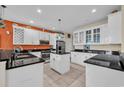 Modern kitchen with stainless steel appliances, black granite countertops, and an island at 830 Channel Cat Cove, Murrells Inlet, SC 29576