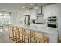 Stylish kitchen with a large island and modern pendant lighting at 8518 Jazz Ct. # 77, Myrtle Beach, SC 29572