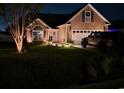 Single-Gathering home with a well-manicured front yard and attached two-car garage at 109 Dry Valley Loop, Myrtle Beach, SC 29588