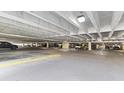 Spacious parking garage featuring ample parking spaces and well-lit interiors for convenient resident parking at 1105 S Ocean Blvd. # 1134, Myrtle Beach, SC 29577