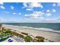 Beach view with beach chairs and umbrellas and a beautiful ocean view from an upper story of the resort at 1105 S Ocean Blvd. # 732, Myrtle Beach, SC 29577
