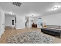 Bright living room with hardwood floors and ample natural light, perfect for relaxation and entertaining at 145 Bendick Ct., Little River, SC 29566