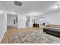 Bright living room with hardwood floors and ample natural light, perfect for relaxation and entertaining at 145 Bendick Ct., Little River, SC 29566