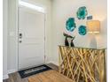 Stylish entryway with decor accents, a patterned rug, and a glass console table at 1454 Nokota Dr., Conway, SC 29526