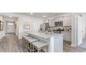 Modern eat-in kitchen features a large island with seating and stainless steel appliances at 1461 Nokota Dr., Conway, SC 29526