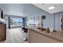 Open-concept living room with bar seating offering an amazing city view at 1605 S Ocean Blvd. # 509, Myrtle Beach, SC 29577