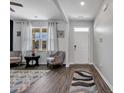 Inviting entryway with wood flooring, neutral walls, and stylish furnishings at 220 Forestbrook Cove Circle, Myrtle Beach, SC 29588