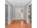 Inviting foyer with wood flooring, neutral walls, and a clear view to the exterior at 2360 Highway 701 North, Loris, SC 29569