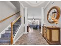 Elegant foyer with decorative columns and staircase at 2385 Windmill Way, Myrtle Beach, SC 29579