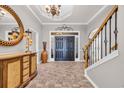 Stunning foyer boasting tile floors, staircase, double doors, and decorative lighting at 2385 Windmill Way, Myrtle Beach, SC 29579