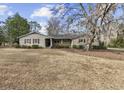 Attractive single-story home featuring a classic design and a spacious front lawn at 3281 Long Avenue Ext., Conway, SC 29526