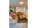 Cozy living room features a TV, couch, and a kitchen in background at 5905 S Kings Hwy. # 1601-C, Myrtle Beach, SC 29575