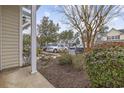 View of the neighborhood and attractive landscaping with a lush bush on the side at 650 Wilshire Ln., Murrells Inlet, SC 29576