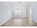 Bright living room with soaring ceilings, modern flooring, and abundant natural light at 650 Wilshire Ln., Murrells Inlet, SC 29576