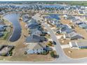 Expansive aerial view of a residential community with multiple ponds and well-maintained landscaping at 901 Tullamore Ct., Myrtle Beach, SC 29579