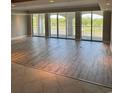 Living room featuring flooring, a wall of windows, and an outdoor view at 9547 Edgerton Dr. # 204, Myrtle Beach, SC 29572