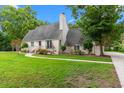 Beautiful single-story home with a well-kept lawn, and lush landscaping along the walkway at 966 Waterway Ln., Myrtle Beach, SC 29572