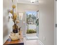 Inviting entryway with light wood floors and view to the exterior at 101 Galil Dr. # A, Myrtle Beach, SC 29579