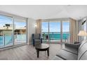 Bright living room featuring stylish furniture and ocean views from a private balcony at 107 S Ocean Blvd. # 601, Myrtle Beach, SC 29577