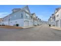 Charming street view of identical two-story coastal homes at 146 Marblehead Dr., Little River, SC 29566