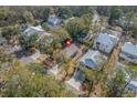 Aerial view of a single-Gathering home nestled among lush trees in a quiet neighborhood at 170 Minnow Dr., Pawleys Island, SC 29585