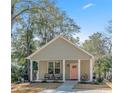 Charming single Gathering home featuring a welcoming front porch and large driveway at 170 Minnow Dr., Pawleys Island, SC 29585