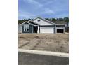 New construction home with blue siding, white trim, a two-car garage and an additional garage with an open bay at 171 Glengrove Lane, Murrells Inlet, SC 29576