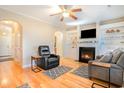 Comfortable living room with hardwood floors, fireplace, and plenty of natural light at 1826 Low Country Pl. # E, Myrtle Beach, SC 29577