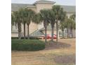 Condo complex with palm tree landscaping featuring green roofs for each unit at 2180 Waterview Dr. # 421, North Myrtle Beach, SC 29582