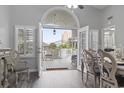 Bright dining area with doors leading to a deck with views of the neighborhood at 300 Oak Lake Circle, North Myrtle Beach, SC 29582