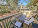 Enjoy wooded views from the outdoor patio with seating at 301 Myrtlewood Ct. # 17-E, Myrtle Beach, SC 29572