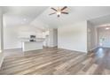 Open concept living area featuring wood floors, plenty of light, and an island kitchen at 3321 Little Bay Dr., Conway, SC 29526